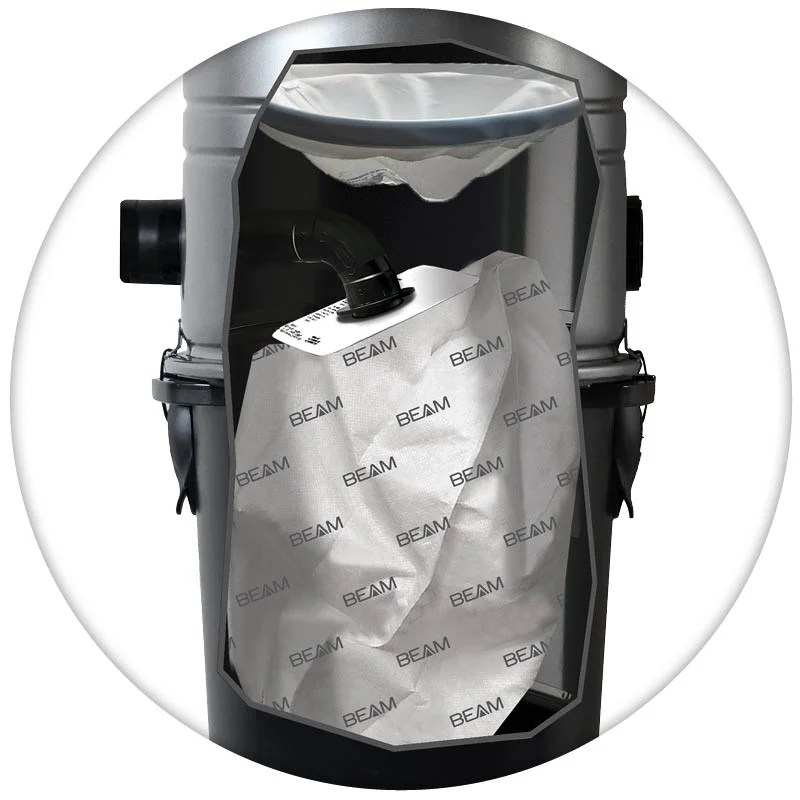 Cutaway of a compact BEAM hybrid central vacuum showing the bag and filter inside the canister